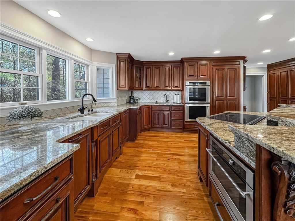 26 Beacon Ridge Circle Salem, SC 29676 - Photo 19 of 46 This spacious kitchen offers ample countertop space, modern appliances, and rich wood cabinetry.