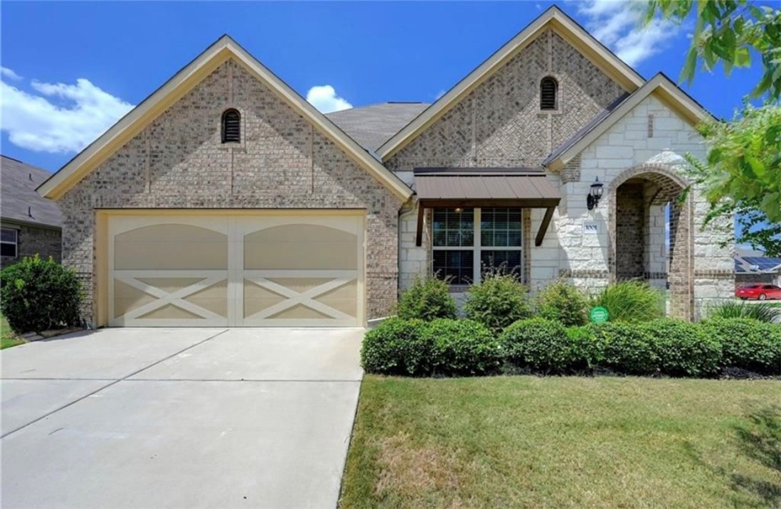 1001 Wolcott Drive Leander, TX 78641 - Photo 1 of 1 a front view of a house with a yard