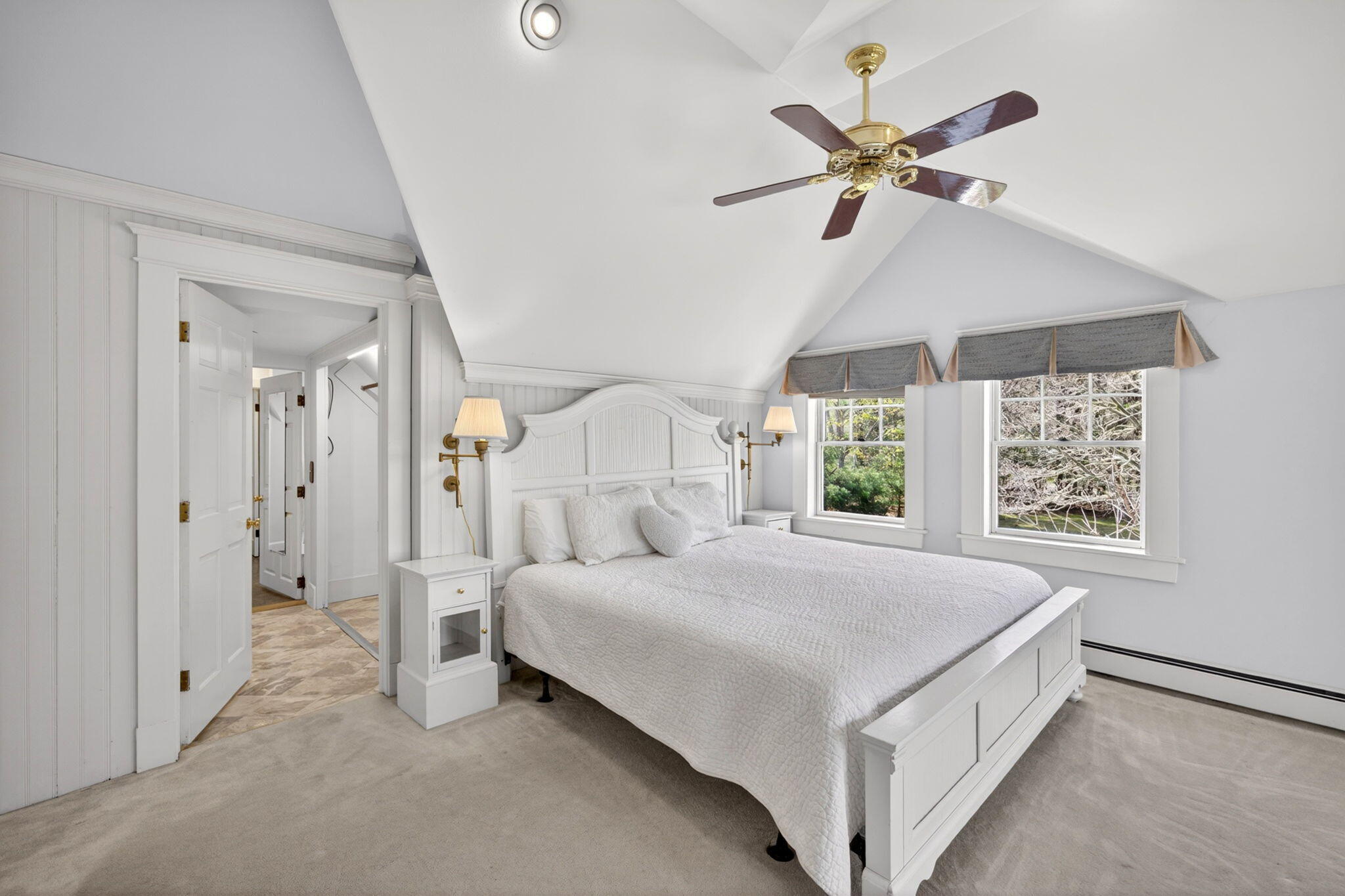 69 County Road Bourne, MA 02532 - Photo 26 of 54 a spacious bedroom with a bed and a chandelier
