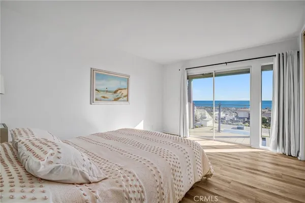 a bedroom with a bed and a fireplace