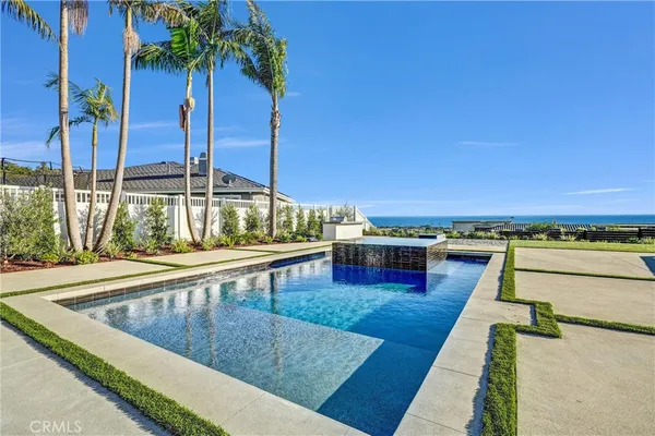 an aerial view of residential building and ocean