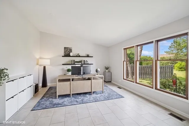 a living room with hard wood floors and a window