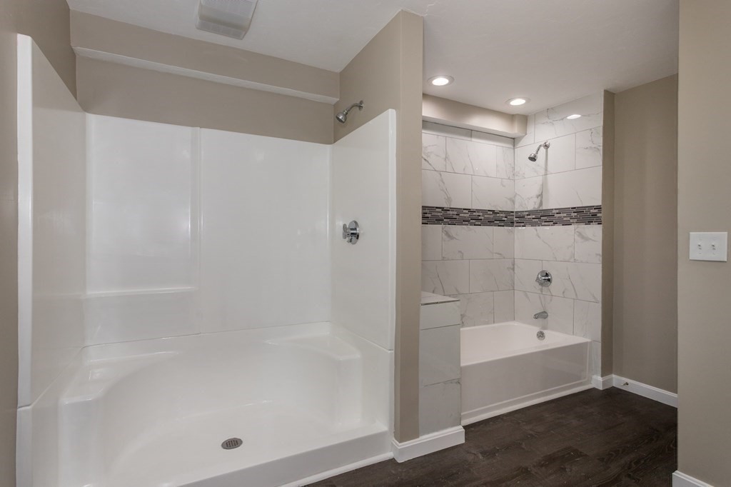 45 Shore Road Ashland, MA 01721 - Photo 12 of 21 a bathroom with a bathtub and a shower
