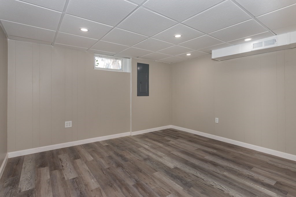 45 Shore Road Ashland, MA 01721 - Photo 15 of 21 an empty room with wooden floor and windows