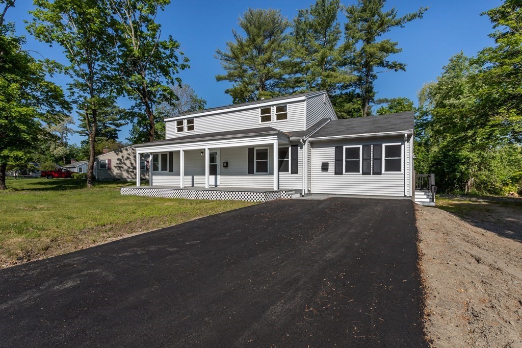 45 Shore Road Ashland, MA 01721 - Photo 2 of 21 front view of a house with a yard