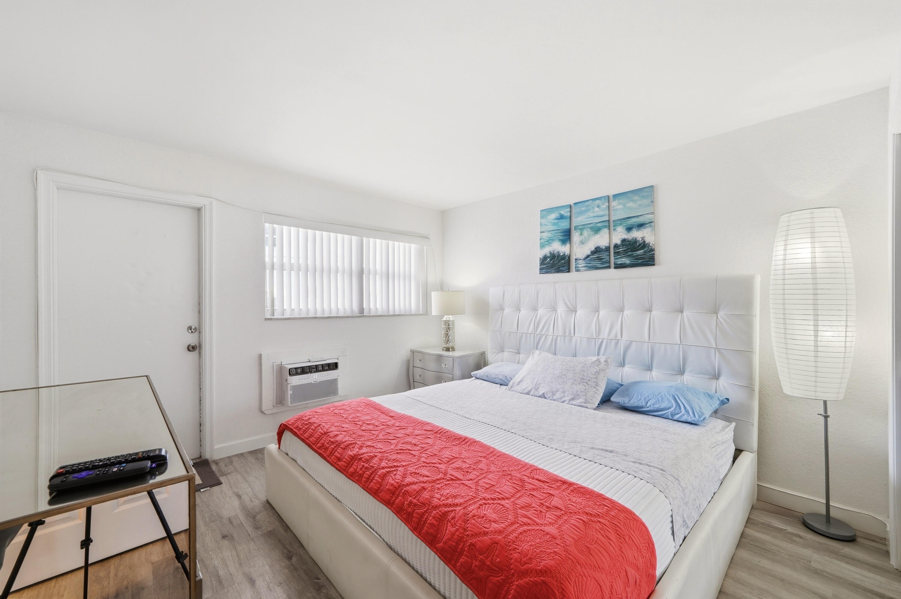 3510 Harrison Street, Unit 4 Hollywood, FL 33021 - Photo 18 of 31 a bedroom with a large bed and a window
