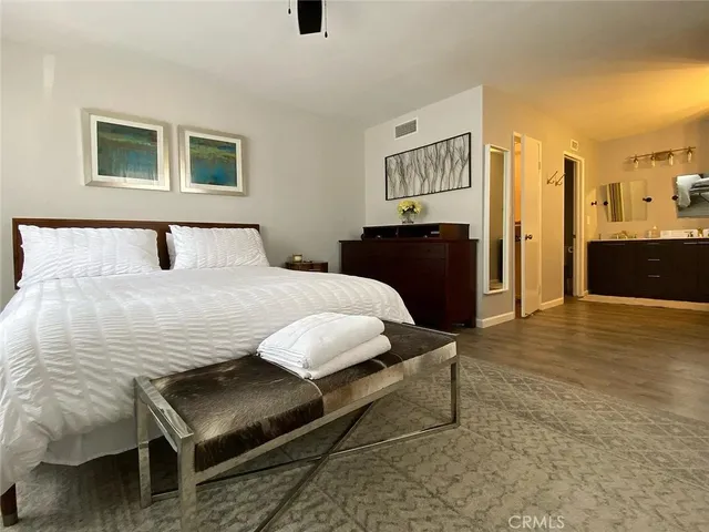 a bedroom with a bed and a table in it
