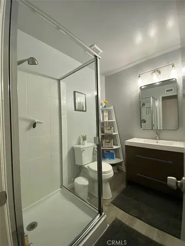 a large bathroom with a double vanity sink and a mirror