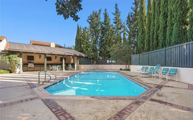 a view of a swimming pool with a patio