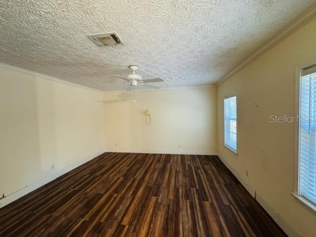 11817 Southwest 58th Street Webster, FL 33597 - Photo 14 of 46 wooden floor in an empty room