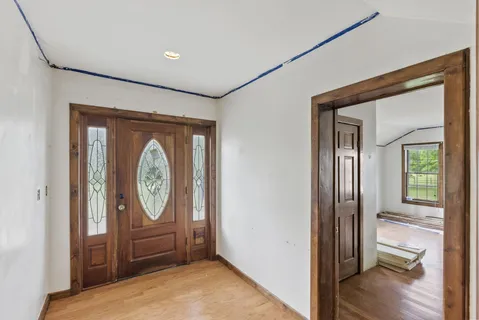 a view of a hallway with wooden floor