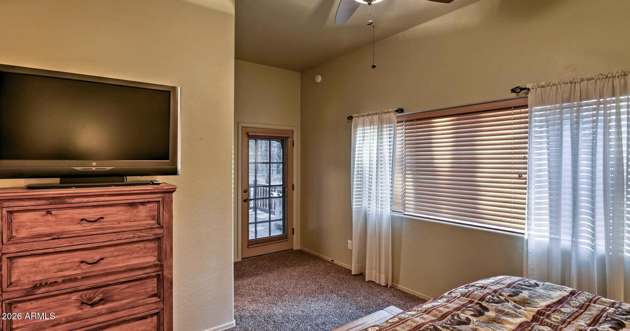 2942 Timber Line Road Pinetop, AZ 85935 - Photo 14 of 27 a bedroom with window and flat screen tv