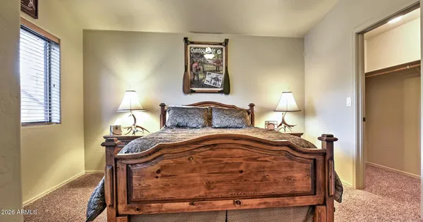 a bedroom with a bed and night stand