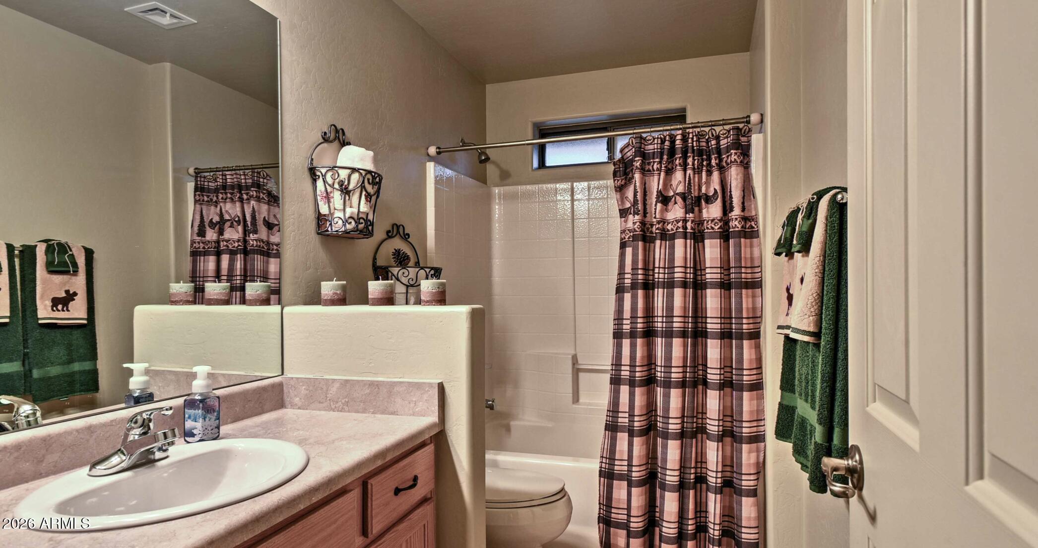 2942 Timber Line Road Pinetop, AZ 85935 - Photo 19 of 27 a bathroom with a sink toilet and shower