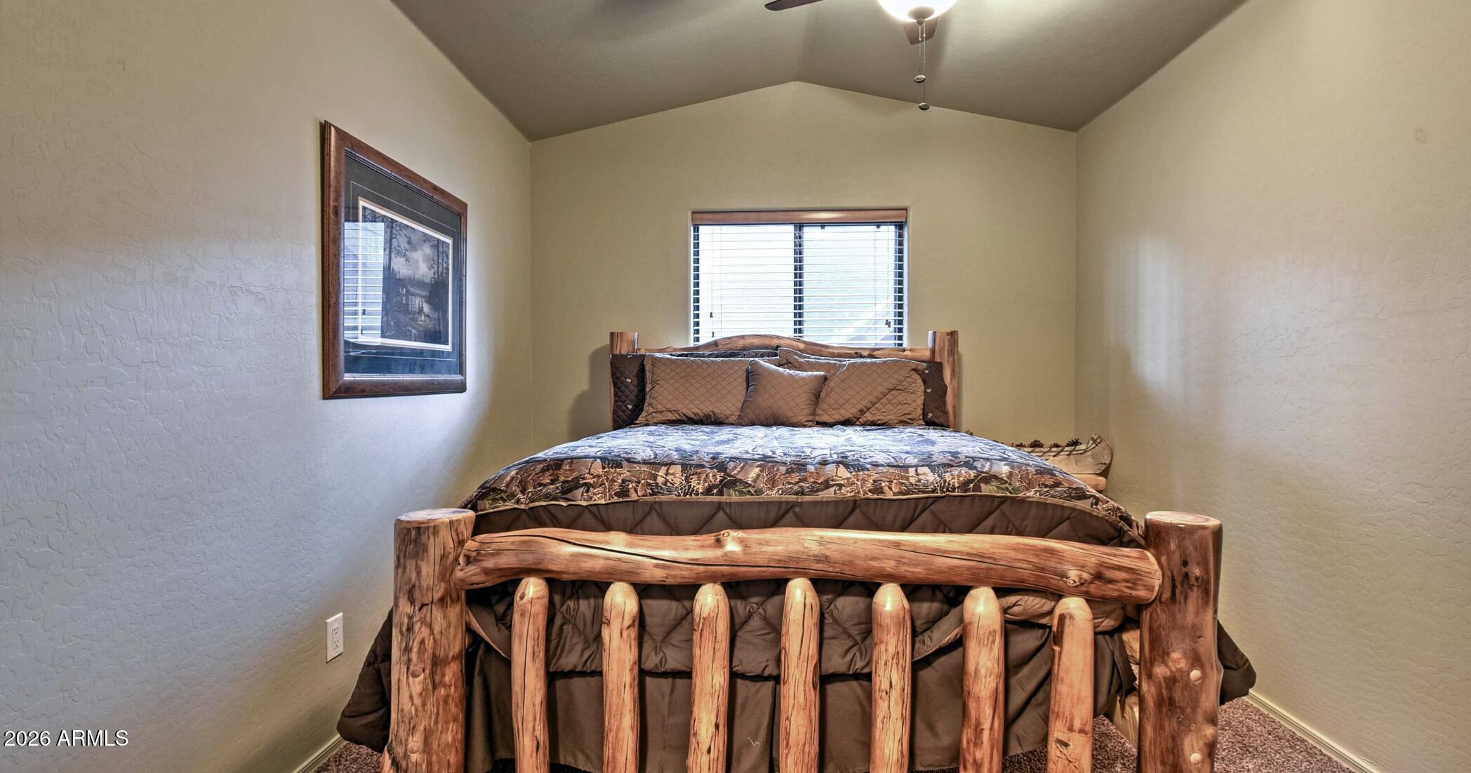2942 Timber Line Road Pinetop, AZ 85935 - Photo 20 of 27 a bedroom with a bed and a window