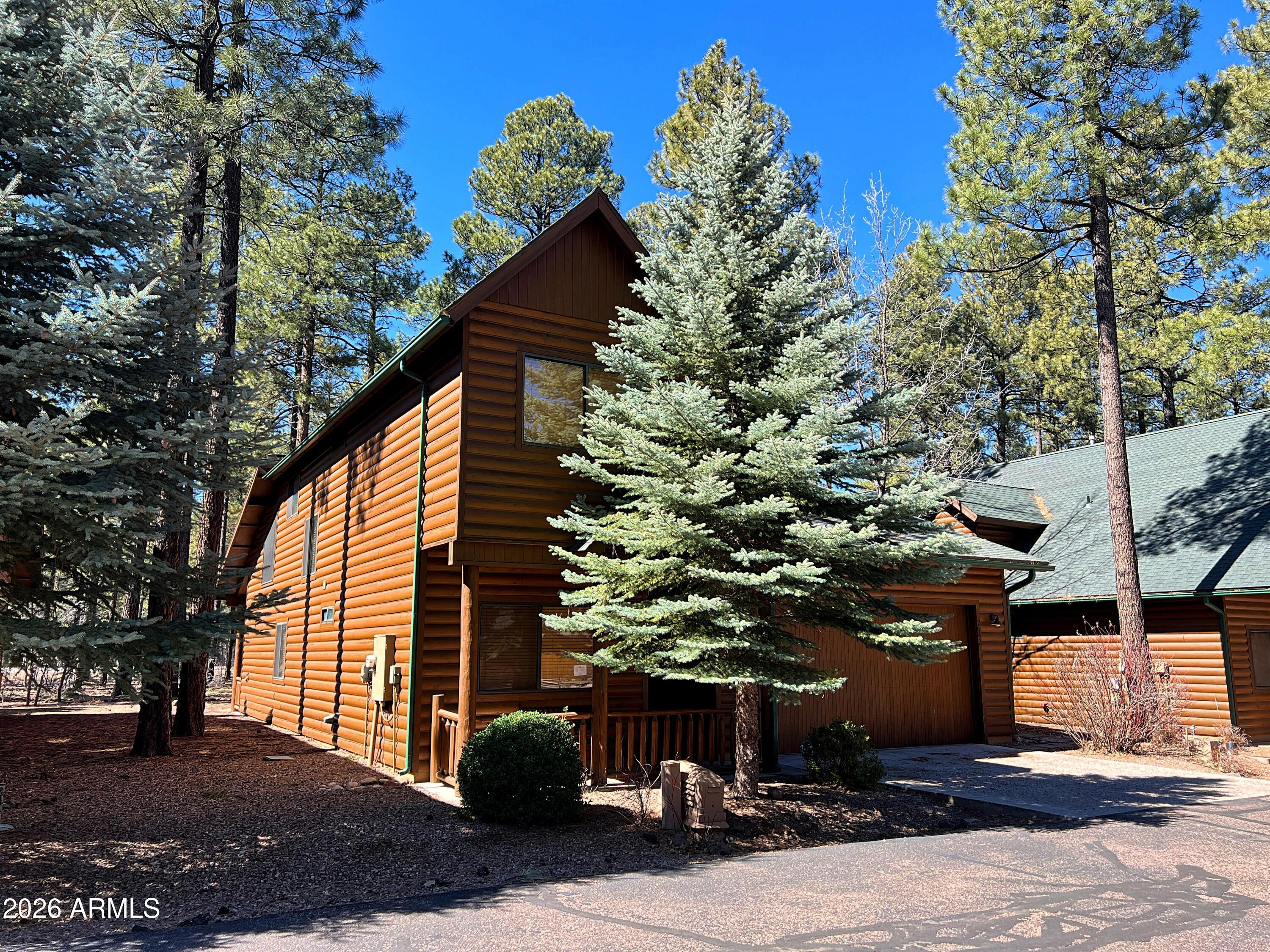 2942 Timber Line Road Pinetop, AZ 85935 - Photo 3 of 27 a view of a house with a tree