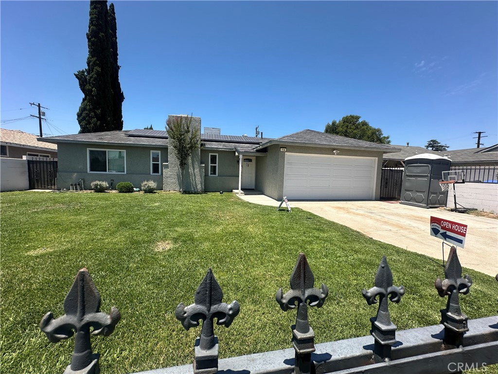 114 South Acacia Avenue Rialto, CA 92376 - Photo 4 of 27 Overall view of the yard and garage and driveway