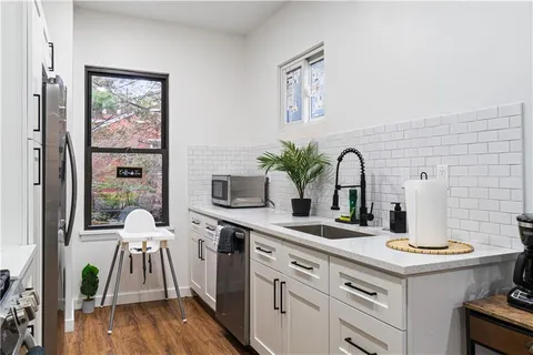 a kitchen with a sink and stove