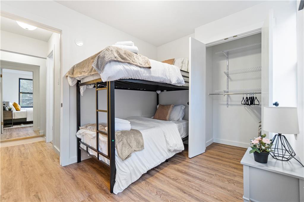 521 Alpine Avenue Pittsburgh, PA 15212 - Photo 20 of 28 a bedroom with a bed and a potted plant on the dresser