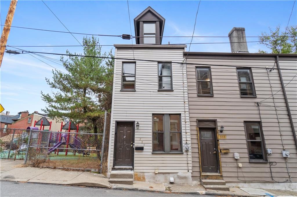 521 Alpine Avenue Pittsburgh, PA 15212 - Photo 2 of 28 a front view of a house with garden
