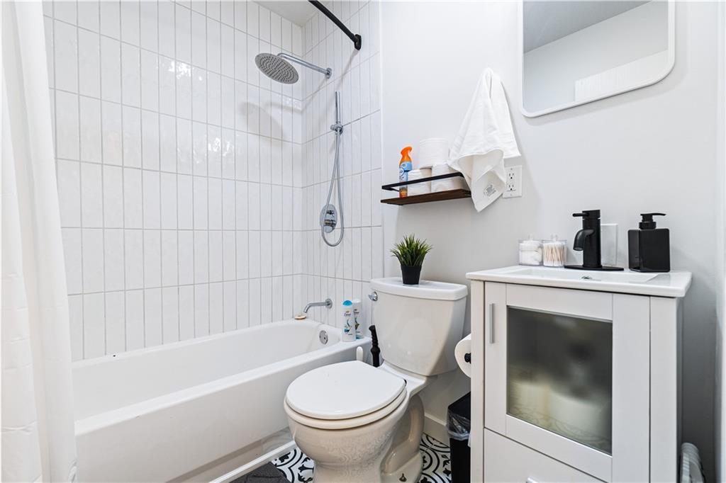 521 Alpine Avenue Pittsburgh, PA 15212 - Photo 24 of 28 a bathroom with a sink a toilet and bathtub