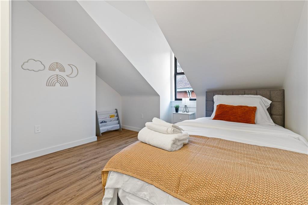 521 Alpine Avenue Pittsburgh, PA 15212 - Photo 25 of 28 a bedroom with a bed and a white wall