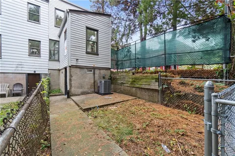 a view of a house with backyard