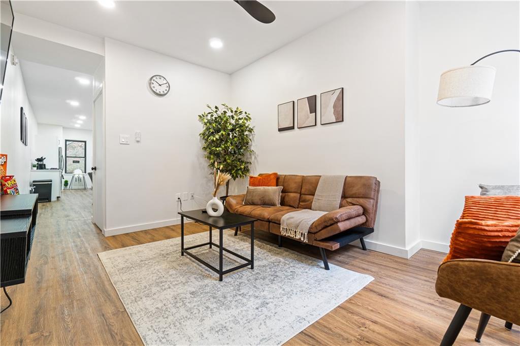 521 Alpine Avenue Pittsburgh, PA 15212 - Photo 4 of 28 a living room with furniture and a wooden floor
