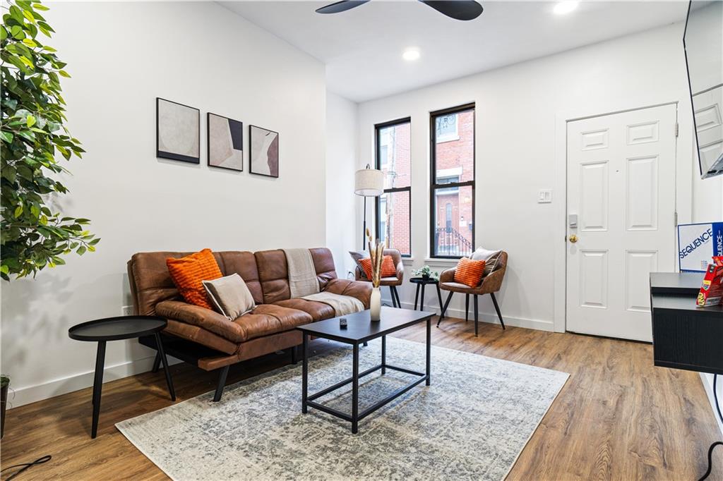 521 Alpine Avenue Pittsburgh, PA 15212 - Photo 5 of 28 a living room with furniture and wooden floor