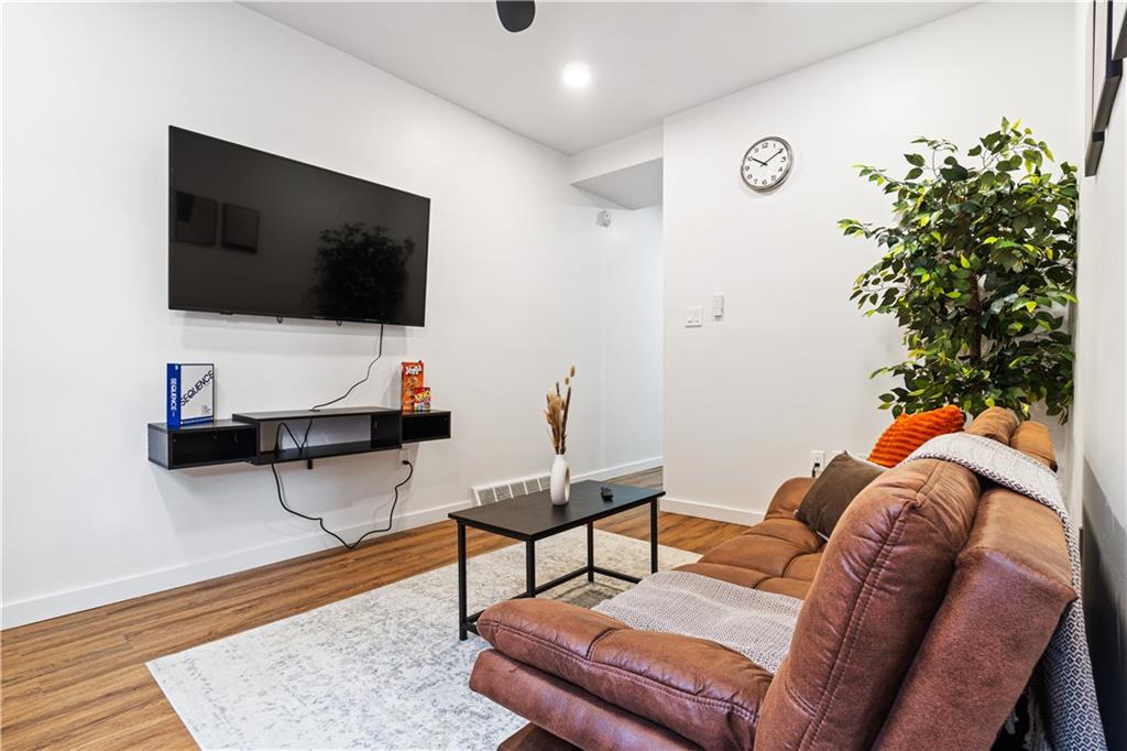 521 Alpine Avenue Pittsburgh, PA 15212 - Photo 6 of 28 a living room with furniture and a flat screen tv