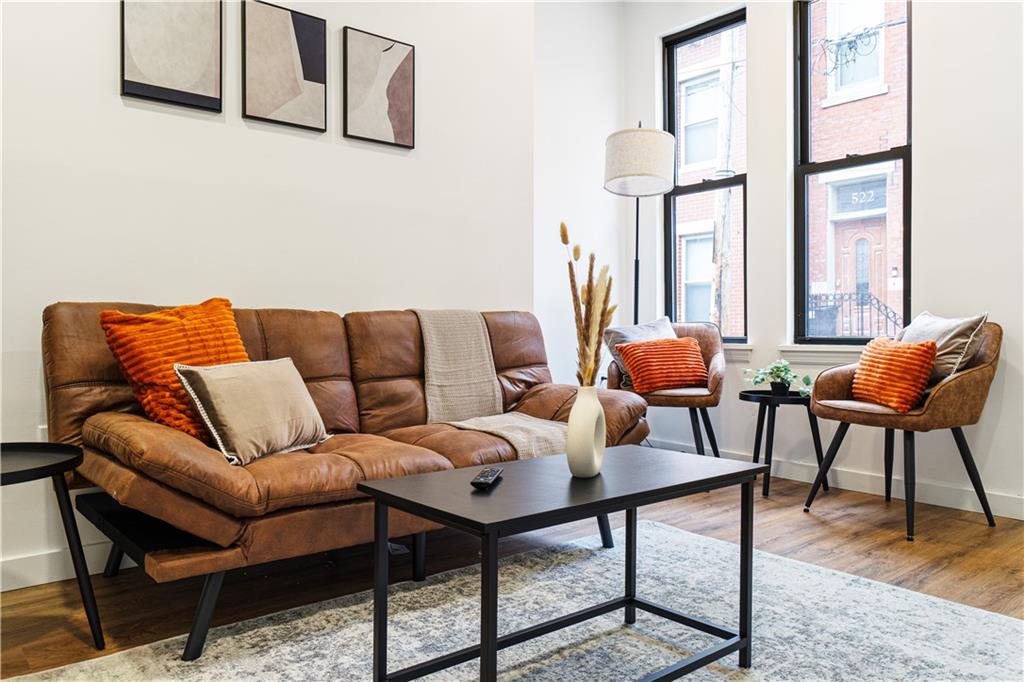 521 Alpine Avenue Pittsburgh, PA 15212 - Photo 7 of 28 a living room with furniture and a large window