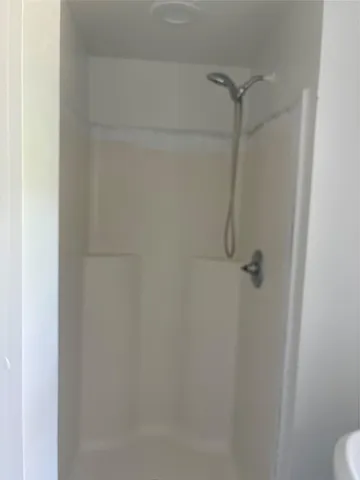 a bathroom with a toilet a sink and a window