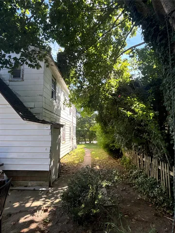 a view of a yard with a tree