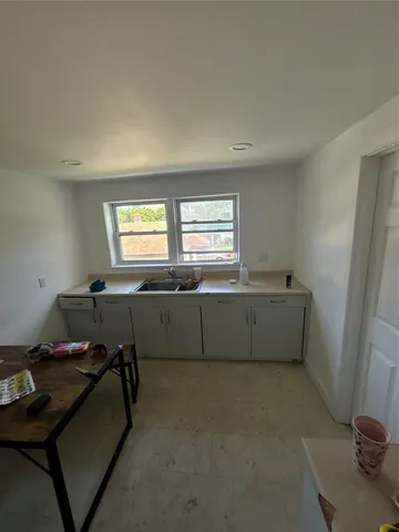 a utility room with washing machine
