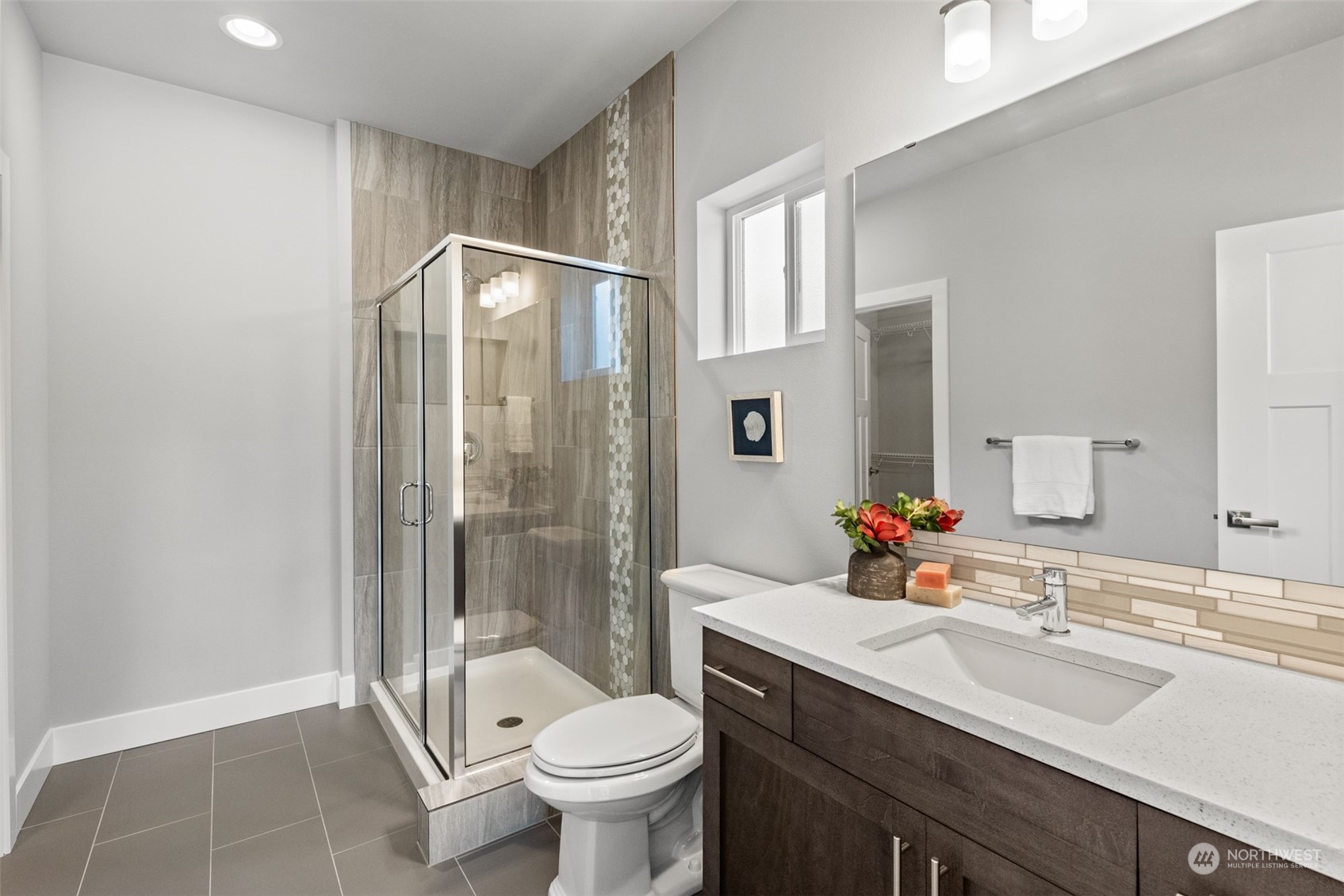21314 43rd Drive Southeast Bothell, WA 98021 - Photo 15 of 38 a bathroom with a sink toilet mirror and shower
