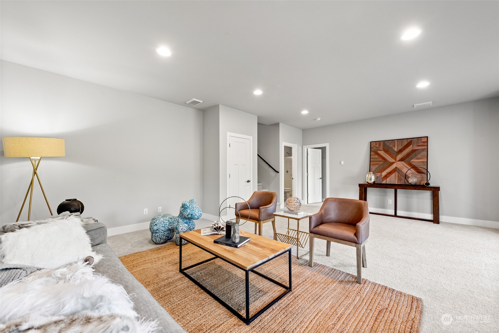 21314 43rd Drive Southeast Bothell, WA 98021 - Photo 32 of 38 a living room with furniture a rug and a lamp
