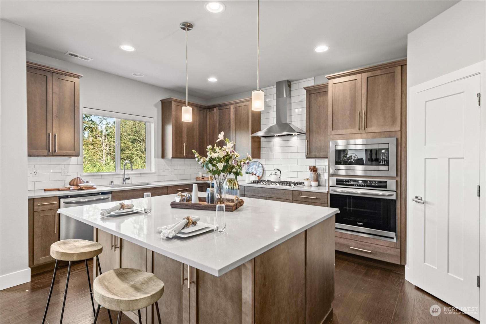 21314 43rd Drive Southeast Bothell, WA 98021 - Photo 9 of 38 a kitchen with a table chairs stove and cabinets