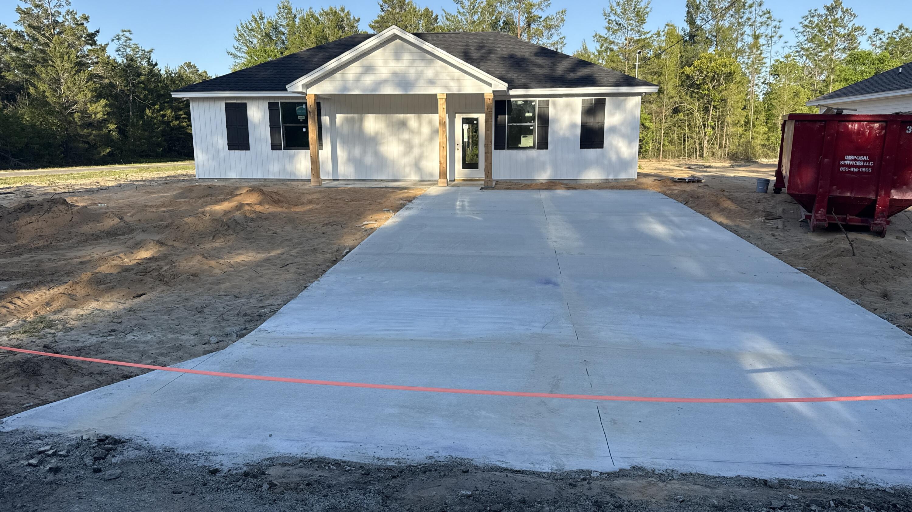 4181 Luar Chipley, FL 32428 - Photo 9 of 28 a front view of a house with a yard and garage