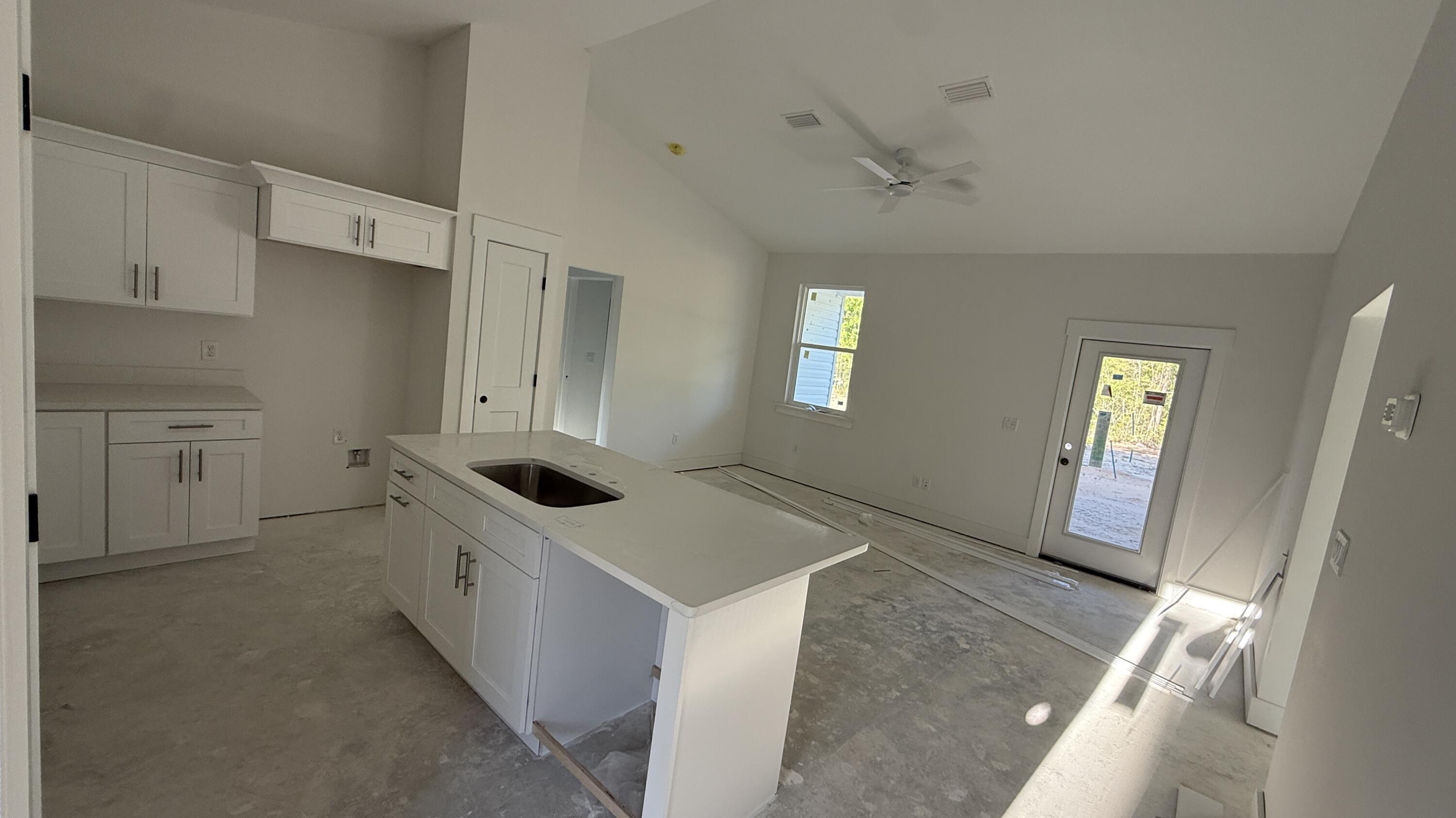 4181 Luar Chipley, FL 32428 - Photo 10 of 28 a kitchen with white cabinets and sink