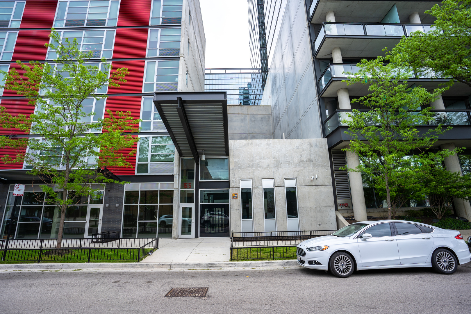 1515 North Fremont Street, Unit 212 Chicago, IL 60642 - Photo 2 of 8 a car parked in front of a building