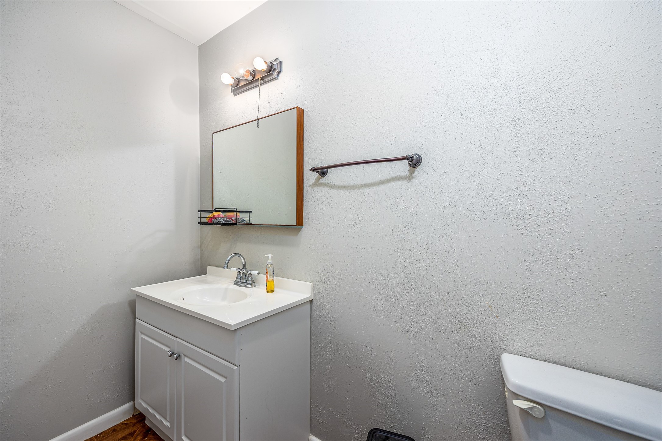 502 Massey Tompkins Road Baytown, TX 77521 - Photo 21 of 32 a bathroom with a toilet sink and mirror