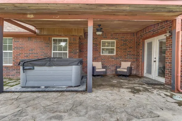 a view of a outdoor space with lounge chair and windows