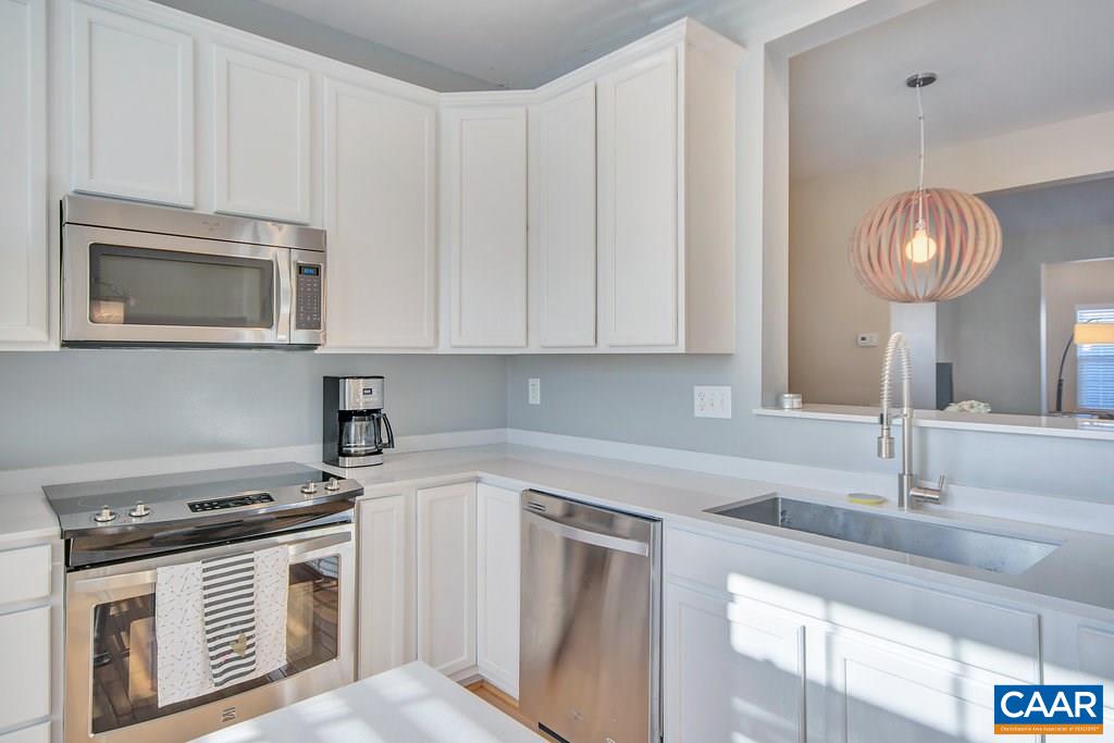 713 Rainier Road Charlottesville, VA 22903 - Photo 14 of 30 a kitchen with cabinets stainless steel appliances and a sink
