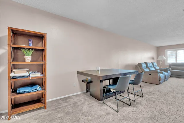 a view of a livingroom with furniture and window