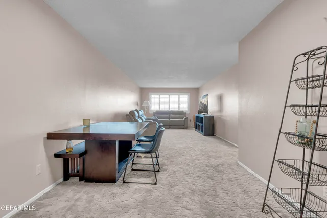 a view of a room with furniture and window