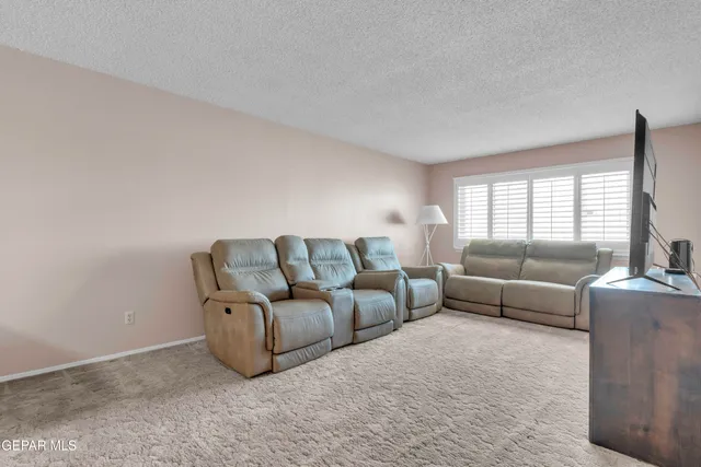 a living room with furniture and a couch