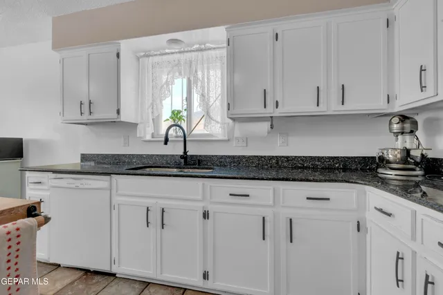a view of a dining room with furniture and window