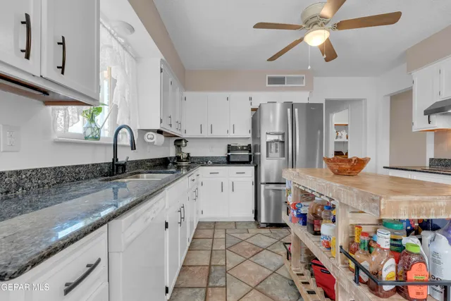 a view of a dining room with furniture and window