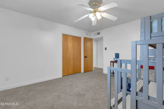 a work room with furniture and wooden floor