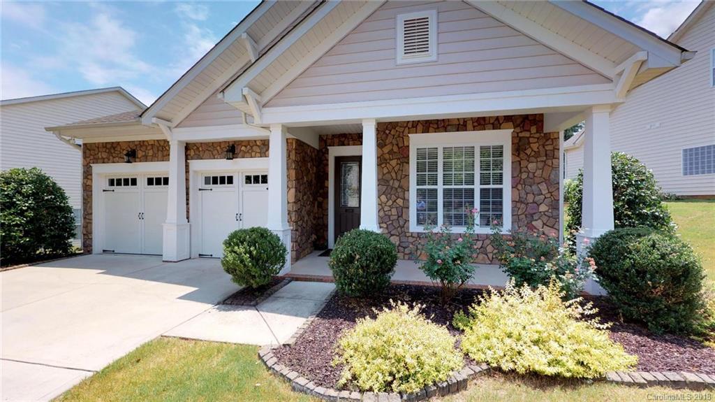 1369 Secret Path Drive Fort Mill, SC 29708 - Photo 2 of 22 a front view of a house with a yard and outdoor seating